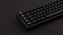 Load image into Gallery viewer, GMK CYL Mictlan on a black confetti finish keyboard left side