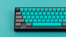 Load image into Gallery viewer, GMK CYL Hatsune Miku on a black Keycult Zero close up on left side