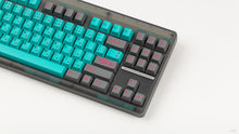 Load image into Gallery viewer, GMK CYL Hatsune Miku on a translucent grey CLASSIC-TKL close up on right side