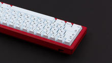 Load image into Gallery viewer, GMK CYL Modern Ink on a red keyboard back view zoome din on left side