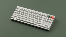 Load image into Gallery viewer, CYL Modern Materials concrete on a silver keyboard