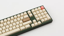 Load image into Gallery viewer, CYL Modern Materials stone on a green keyboard close up on right