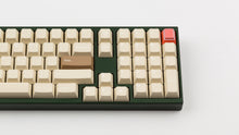 Load image into Gallery viewer, CYL Modern Materials stone on a green keyboard close up on right