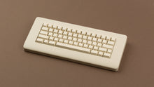 Load image into Gallery viewer, CYL Modern Materials stone on a beige keyboard