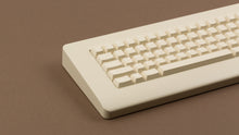 Load image into Gallery viewer, CYL Modern Materials stone on a beige keyboard close up on left