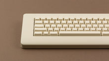 Load image into Gallery viewer, CYL Modern Materials stone on a beige keyboard close up on right