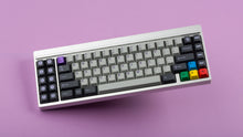 Load image into Gallery viewer, GMK CYK NTD on silver keyboard  angled