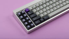 Load image into Gallery viewer, GMK CYK NTD on silver keyboard zoomed in on left