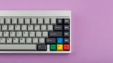 Load image into Gallery viewer, GMK CYK NTD on silver keyboard zoomed in on right