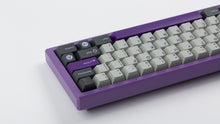 Load image into Gallery viewer, GMK CYK NTD on purple keyboard back view zoomed in on right side