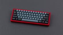 Load image into Gallery viewer, GMK CYL Nord on a red keyboard angled