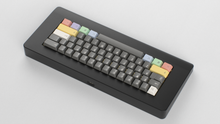 Load image into Gallery viewer, Render of GMK CYL Power 2048 keycaps on the Piggy, wide shot