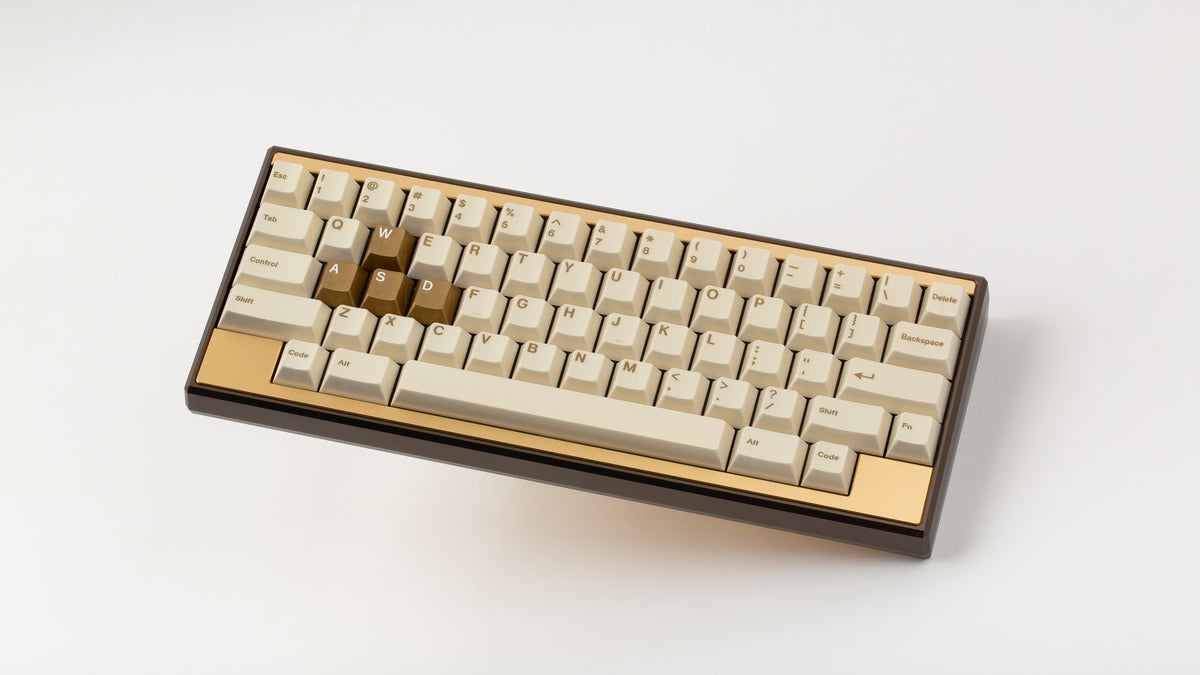  GMK CYL Rainbow 6 Siege - Winner's Circle on a Dark Gold Keycult Zero with Gold HHKB accent bars angled 