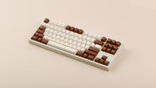 Load image into Gallery viewer, GMK CYL Tiramisu on beige keyboard angled