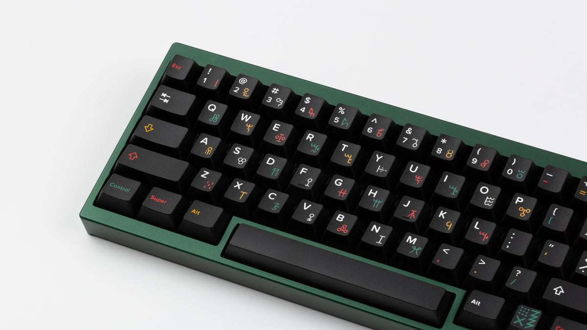  GMK CYL Tribal on a green keyboard close up on left side angled 