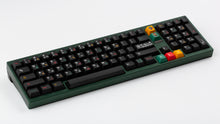 Load image into Gallery viewer, GMK CYL Tribal on a green keyboard angled