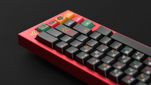 Load image into Gallery viewer, render of GMK CYL Tribal on a red keyboard back view angled