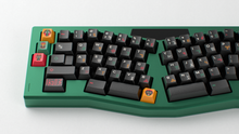 Load image into Gallery viewer, render of GMK CYL Tribal on a green keyboard close up on left side