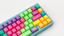Load image into Gallery viewer, GMK CYL Windbreaker keycaps close-up of right side with novelties on light blue 65% keyboard