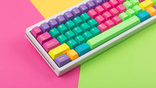 Load image into Gallery viewer, GMK CYL Windbreaker keycaps close-up of left side on white 65% keyboard, colorful background