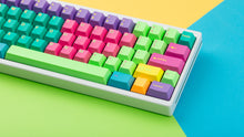 Load image into Gallery viewer, GMK CYL Windbreaker keycaps close-up of right side on white 65% keyboard, colorful background