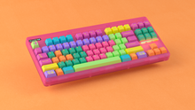 Load image into Gallery viewer, render of GMK CYL Windbreaker on a Pink CLASSIC-TKL on an orange background angled