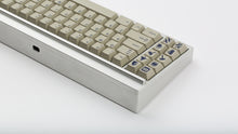 Load image into Gallery viewer, GMK CYL Winkler on a silver keyboard back view of left side close up