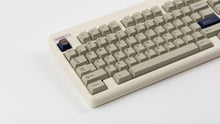 Load image into Gallery viewer, GMK CYL Winkler on a Beige CLASSIC-TKL close up left side