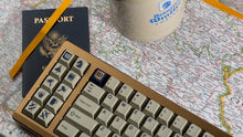 Load image into Gallery viewer, GMK CYL Winkler keycaps and stein on a map angled