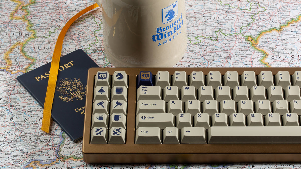  GMK CYL Winkler keycaps and stein on a map 