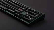 Load image into Gallery viewer, GMK CYL WoB Addon on green keyboard zoomed in on right