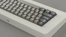 Load image into Gallery viewer, render of GMK CYL Dolch R5X on a cream keyboard back view close up on left side