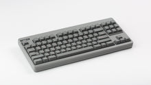 Load image into Gallery viewer, GMK CYL Hooty on a CLASSIC-TKL Regolith keyboard angled