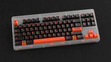 Load image into Gallery viewer, render of GMK CYL Kaiju R3 Kaiju Dark on a clear CLASSIC-TKL angled on a black background