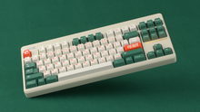 Load image into Gallery viewer, render of GMK CYL Kaiju R3 kaiju on a beige CLASSIC-TKL angled on a green background