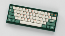 Load image into Gallery viewer, render of GMK CYL Kaiju R3 kaiju on a green Keycult Zero angled