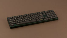 Load image into Gallery viewer, MTNU 800 on a green keyboard angled