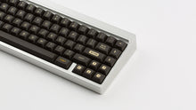 Load image into Gallery viewer, MTNU 800 on a silver keyboard close up of right side
