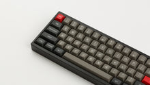 Load image into Gallery viewer, MTNU Dolch on a Black Keyboard close up left side