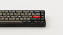 Load image into Gallery viewer, MTNU Dolch on a Black Keyboard close up right side