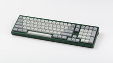 Load image into Gallery viewer, MTNU Granite on a green keyboard angled