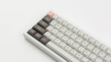 Load image into Gallery viewer, GMK MTNU R&amp;D 1973 on a white keyboard close up on left side