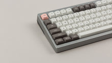 Load image into Gallery viewer, GMK MTNU R&amp;D 1973 on a silver keyboard close up on left side