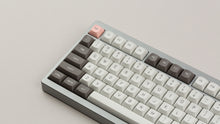 Load image into Gallery viewer, GMK MTNU R&amp;D 1973 on a  silver keyboard close up on left side angled