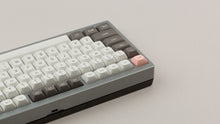 Load image into Gallery viewer, GMK MTNU R&amp;D 1973 on a silver keyboard back view of left side