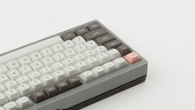 Load image into Gallery viewer, GMK MTNU R&amp;D 1973 on a silver keyboard back view of left side close up