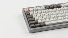 Load image into Gallery viewer, GMK MTNU R&amp;D 1973 on a silver keyboard close up left side