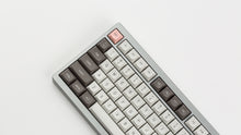 Load image into Gallery viewer, GMK MTNU R&amp;D 1973 on a silver keyboard angled close up on left side