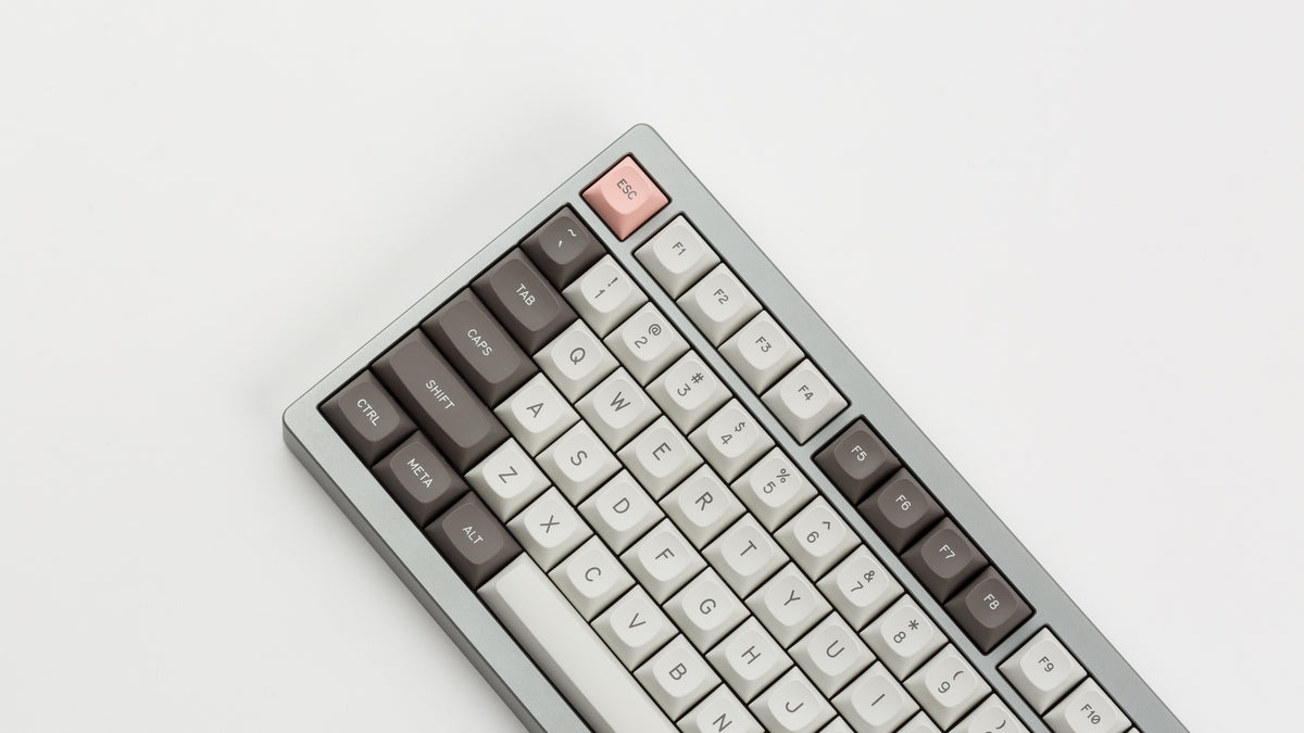  GMK MTNU R&D 1973 on a silver keyboard angled close up on left side 