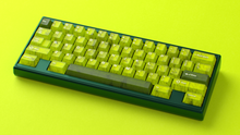 Load image into Gallery viewer, render of GMK CYL Mutagen on a green Keycult Zero angled on a green background